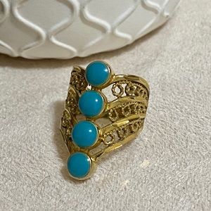 4 layers gold coloured ring with 4 turquoise oval